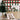 Removable Christmas plaid wallpaper featuring a traditional red, green, and cream tartan pattern—ideal for adding festive warmth and texture to holiday-themed rooms or cozy corners.