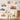 Illustrated emergency vehicle wall decals including a red rescue helicopter, fire truck, police car, ambulance, and orange tow truck, set against a light gray background with soft shading.