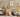 Savanna animal wall decal set featuring soft, hand-painted illustrations of a zebra, elephant, lion, giraffe, rhino, meerkat, and ostrich. Set against a warm taupe wall in a cozy nursery, the design creates a playful safari scene filled with natural textures and earthy tones—perfect for kids' rooms inspired by wildlife and adventure.